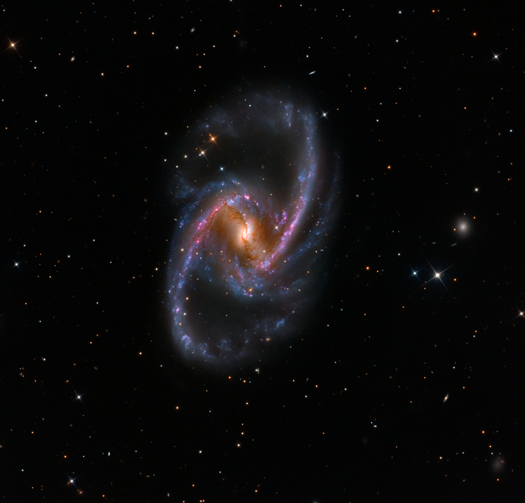 NGC 1365 ist ein gewaltig großes Inseluniversum im Sternbild Chemischer Ofen.