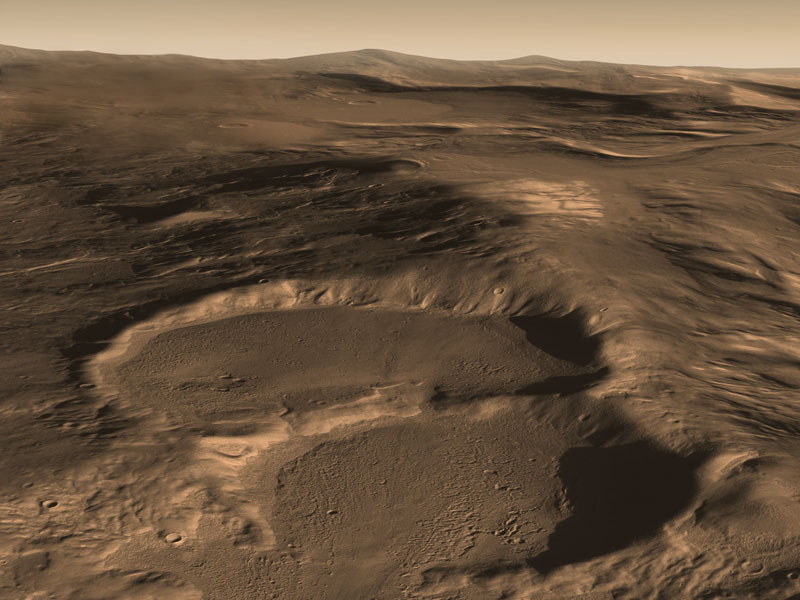 Marslandschaft mit zwei großen Einschlagsbecken im Vordergrund.