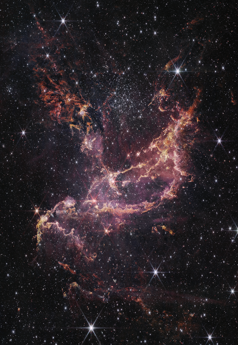 Der Sternhaufen NGC 346 ist in eine Molekülwolke in der Kleinen Magellanschen Wolke eingebettet. Genaue Beschreibung im Text.
