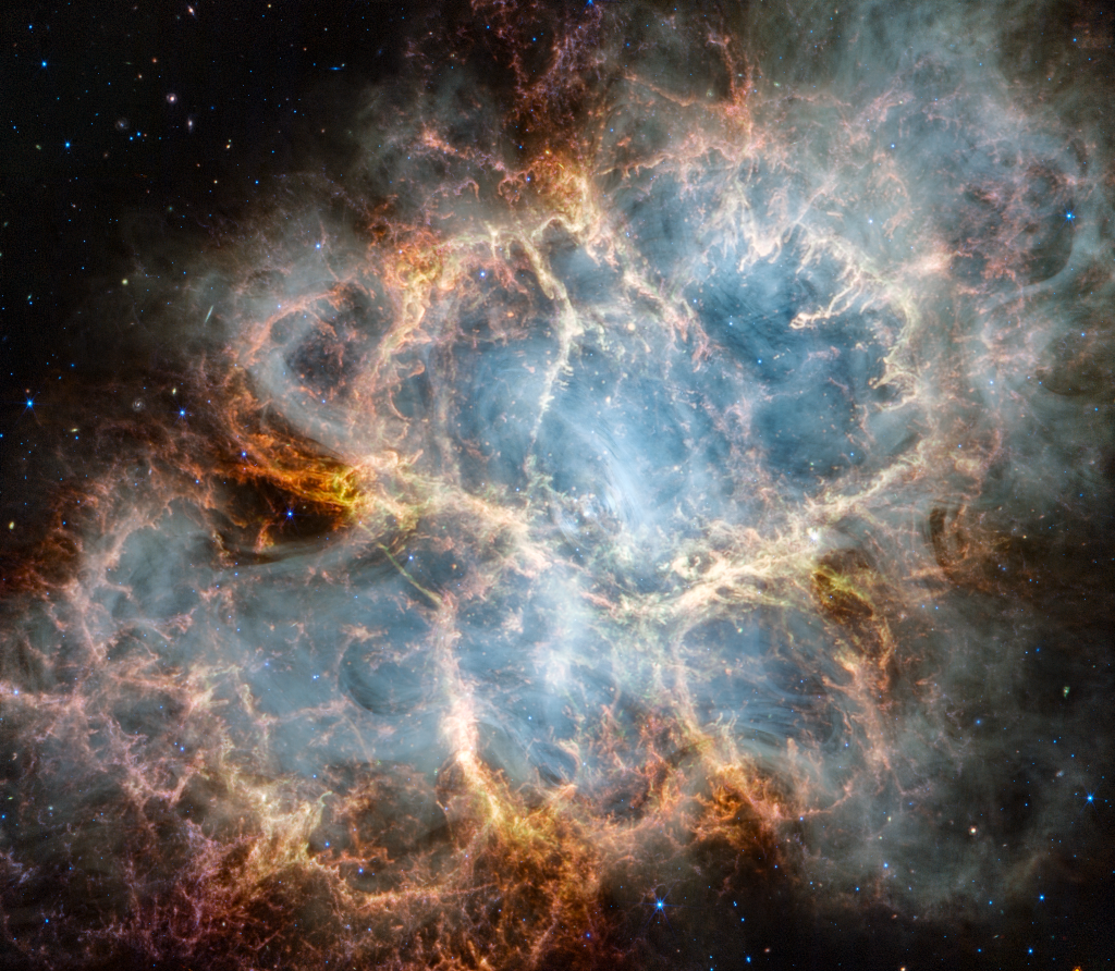 Der Krebsnebel M1 wurde vom Weltraumteleskop James Webb abgebildet. Das Rollover-Bild zeigt denselben Krebsnebel, diesmal jedoch vom Weltraumteleskop Hubble. Das Webb-Bild wurde im nahen Infrarot aufgenommen, das Hubble-Bild im sichtbaren Licht.